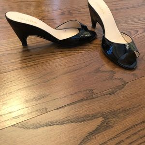 prada black patent leather mule.